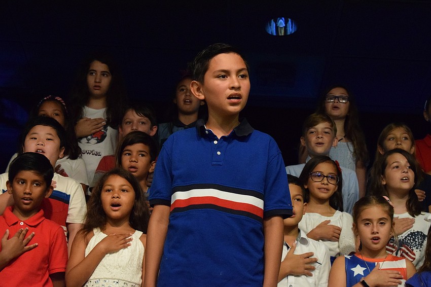 Omar Guzman leads the Pledge of Allegiance at the beginning of the Veterans Day ceremony.