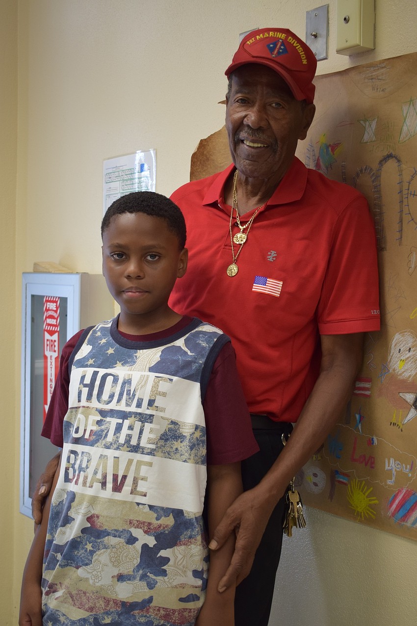 Marine Corps veteran Horras Sheffield enjoys seeing his grandson, Rondre Dent, a fourth-grader, perform during the Veterans Day ceremony. 