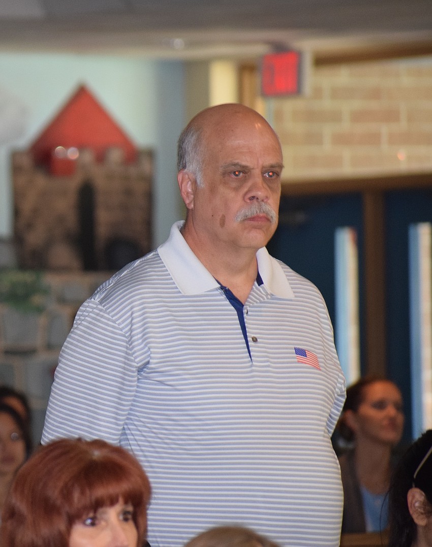 Navy veteran Elby Duckworth stands to be recognized during Tara Elementary School's Veterans Day ceremony. Duckworth was one of several veterans and first responders who attended the ceremony.