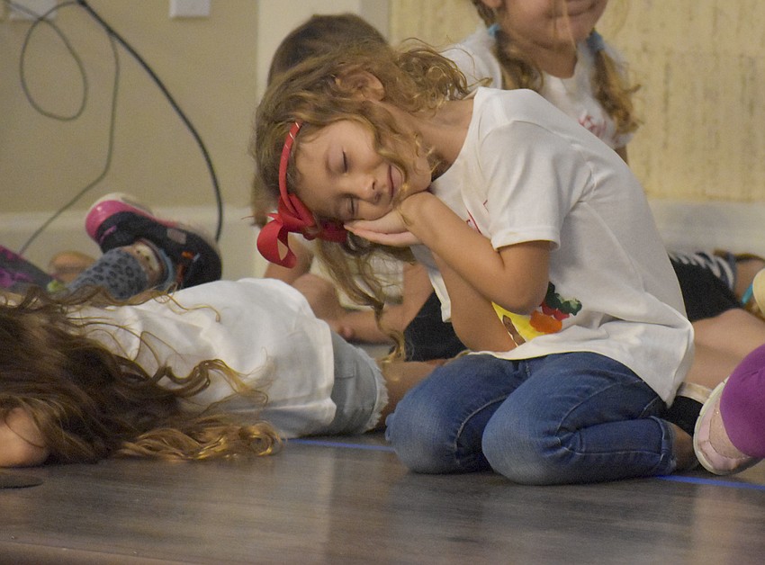 Alane DeRoue shows how the turkeys go to sleep during the pageant.