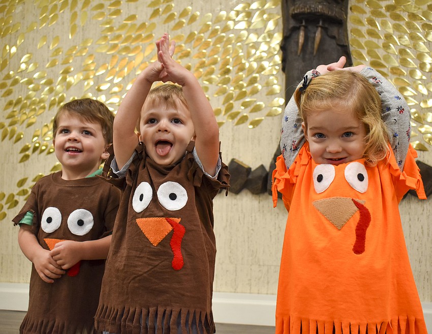Eoin Young, Mason Goldberg and Genevieve George play around on stage.