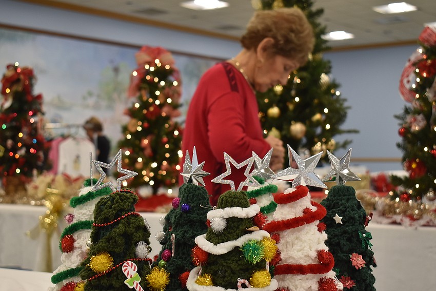 Jane Vorel checks on some trees.