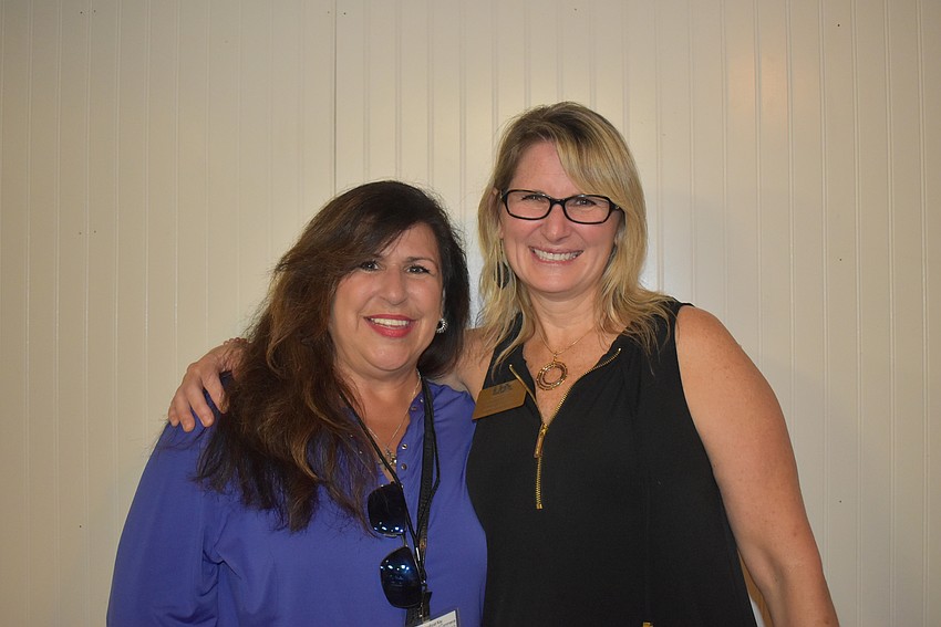 2014 chairwoman Yvonne Schloss and incoming chairwoman Tonya Atchison.