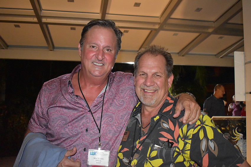 Michael Doll and 2018 chairman Mark Meador.