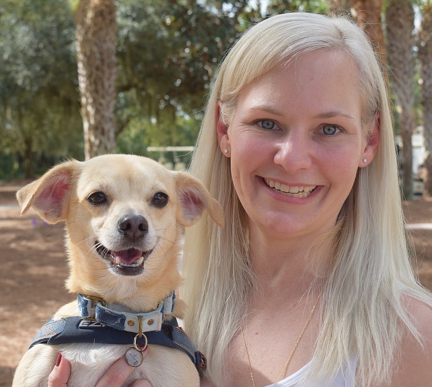Volunteer Kristy Howland brought her chihuahua mix, Henry, to the event. Henry is a rescue dog.