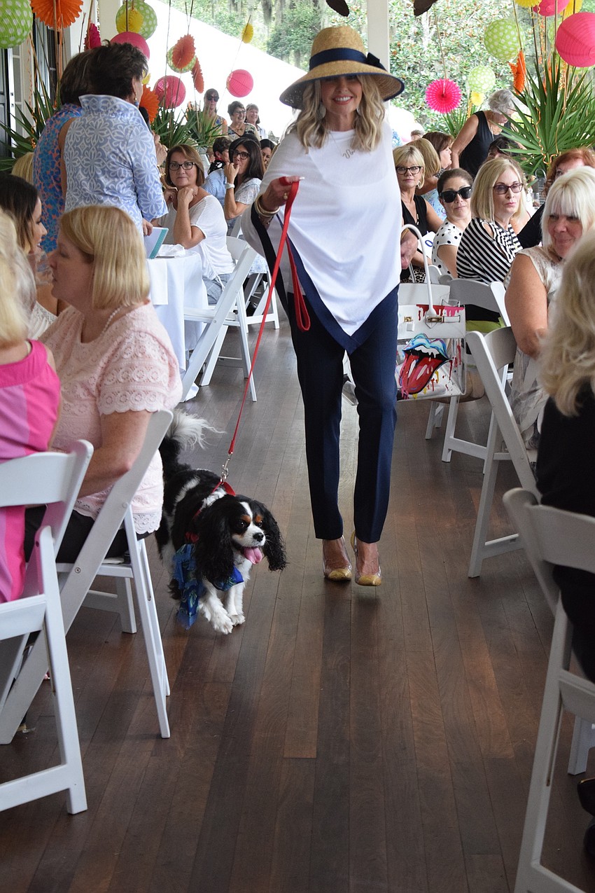 Lakewood Ranch's Donna Brierton and her dog, Brody, make their way through the crowd at Divas and Dogs.