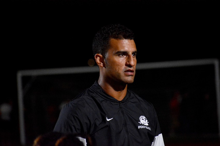 Pirates coach Curt Bradley talks to his team after the loss.