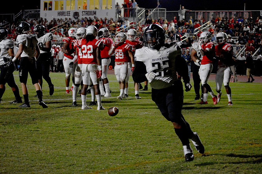 Pirates junior running back Lavontay Youmans heads to the sideline after rolling into the end zone.