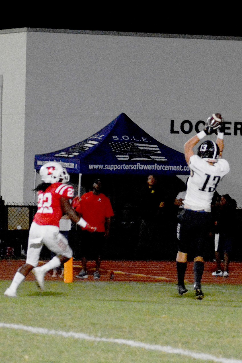 Pirates junior tight end Carson Goda hauls in a touchdown pass from senior Robbie Goecker on a wide recevier pass trick play.