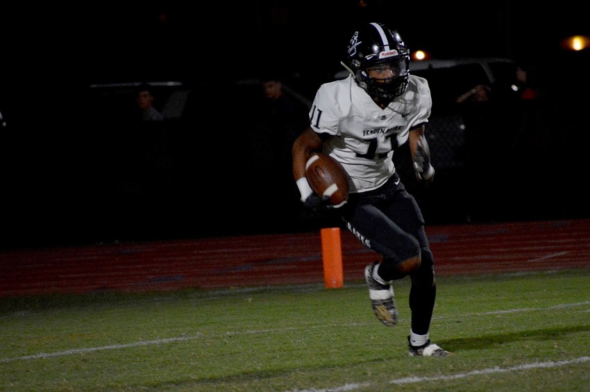 Pirates junior wideout Josh Thomas takes the ball upfield on a kickoff return.
