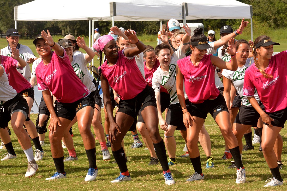 Elizabeth Mosqueda (center) dances with her teammates after claiming victory over Stella Ultimate.