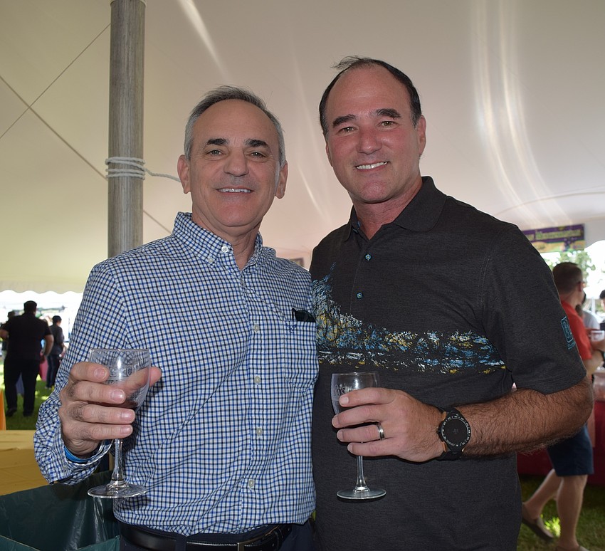 Lakewood Ranch residents Steve Sotir and Tom Wilwert have fun with friends during the Suncoast Food and Wine Fest.