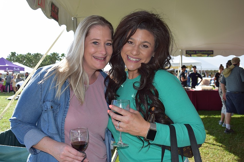 Parrish resident Jessica Zambello and Ellenton resident Elizabeth Henderson have a good time at their first Suncoast Food and Wine Fest.