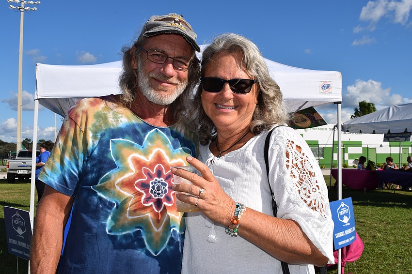 Tampa's Charlie White and Sarasota's Lisa Bohn enjoy their first time at the Food and Wine Fest. 