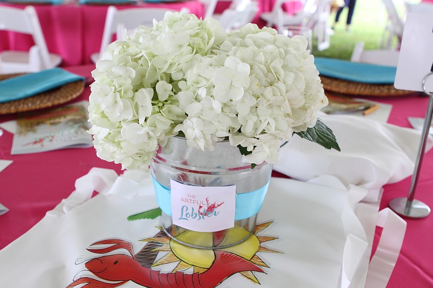 Each table had flowers and lobster bibs for guests.