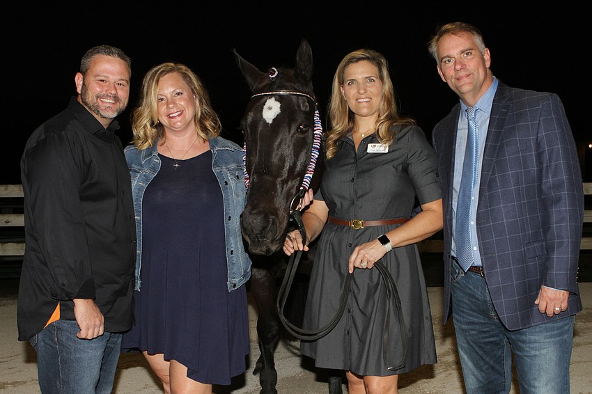 Mark and Erica Mulder with Sam the horse and Lisa and Robbie Spillman