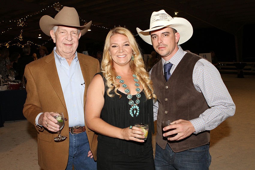 Mike and Lindsay Roth with Thomas Rizza