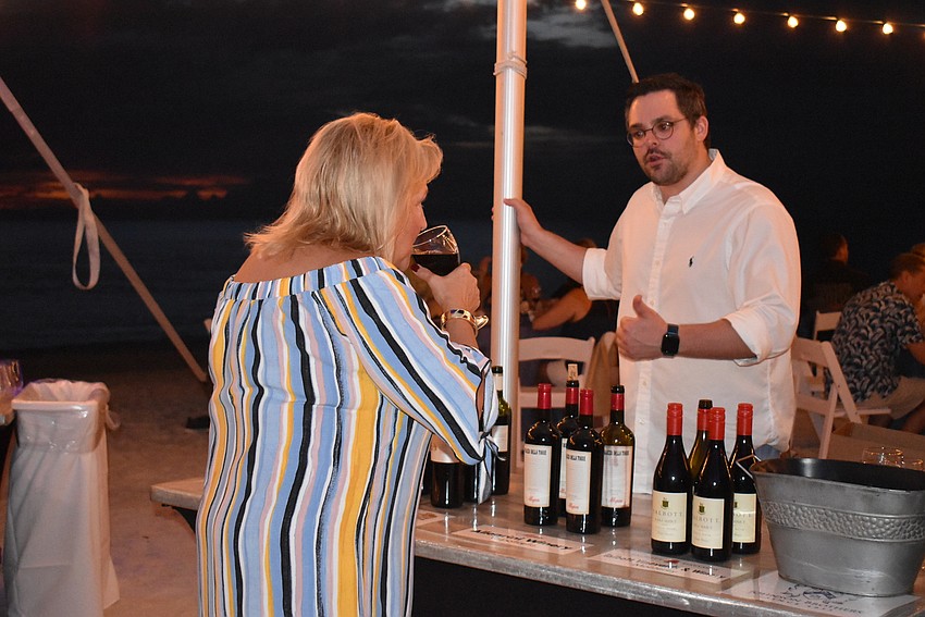 Stephen Fatica poured a glass for Jackie Wise.