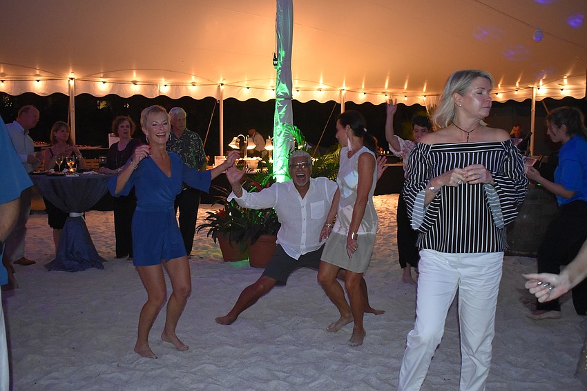 The dancing heats up on the sand.