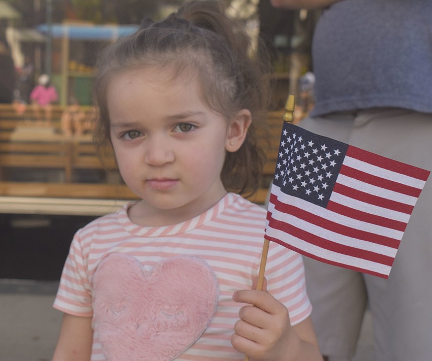 Bella Montiel, 2, waits for the parade to begin.