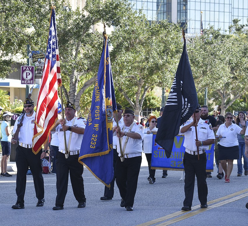Members of American Legion Post 3233 march in the parade.