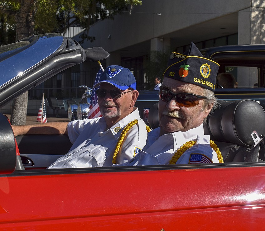 Gordon Gage and Richard Longridge from American Legion Post 30 wait for the parade to begin.