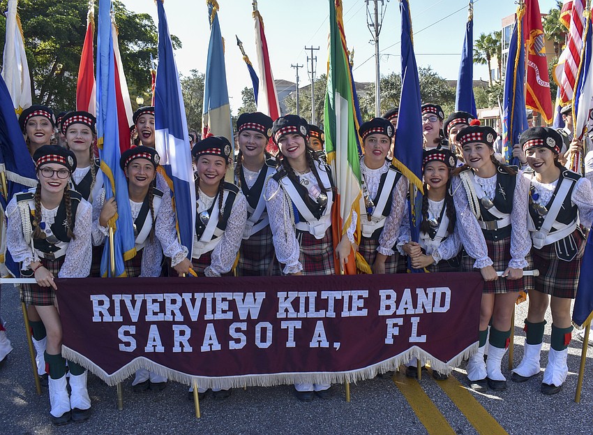 Members of the Riverview High School Kiltie marching band prepare for the parade.