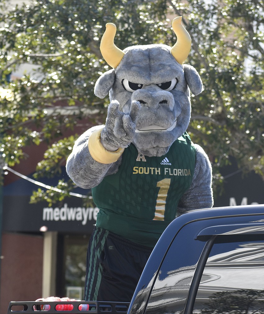 Rocky the Bull, University of South Florida mascot, joins the parade.