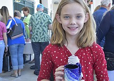 Katie Dick, 9, picks out her new mug.