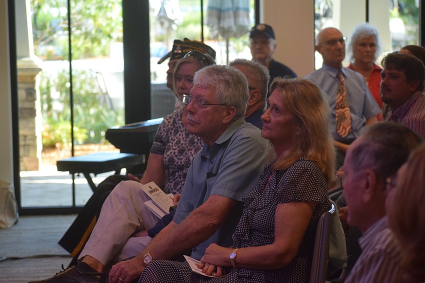 Don and Vanessa Baugh, a Manatee County commissioner, listen to the Veterans Day ceremony at Del Webb.
