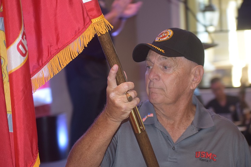 U.S. Marines veteran John Sleyter is honored during the Veterans Day ceremony at Del Webb.
