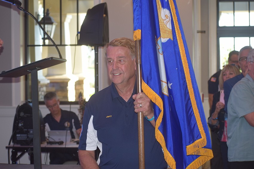 Air Force veteran Jerry Hufford presents the colors.