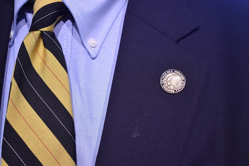 The Vietnam War veteran commemorative pin Dr. Minken wears.