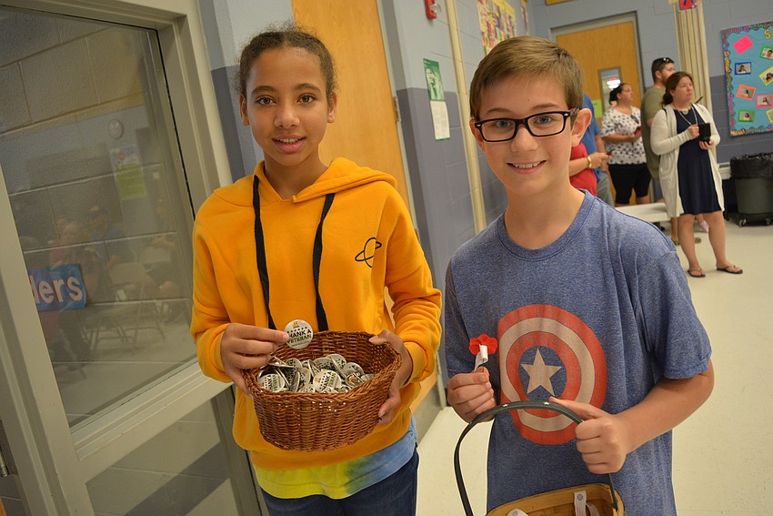 Kiana Brito and John Carter, both 11, pass out 