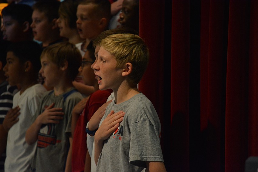 Bryce Jandula knew the words to all the songs. He and classmates sing about 