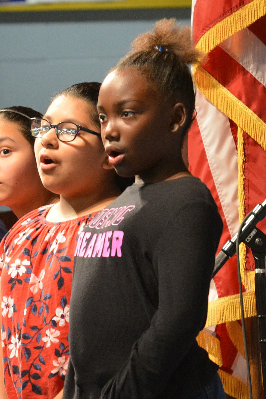 Nina Macias and Jada Snipes performed patriotic songs alongside other fifth-grade students.