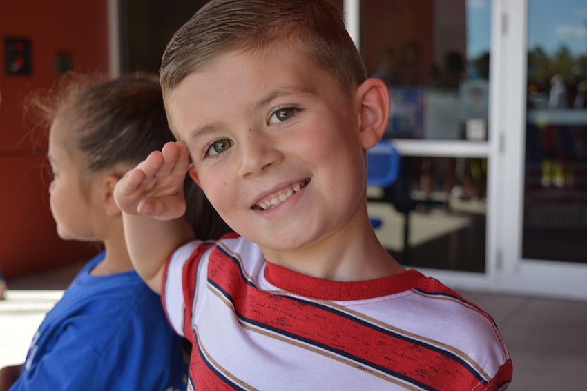 First-grader Mason Colabelli saluted whenever it seemed appropriate. He also got to ring the bell in Freedom's Let Freedom Ring courtyard.