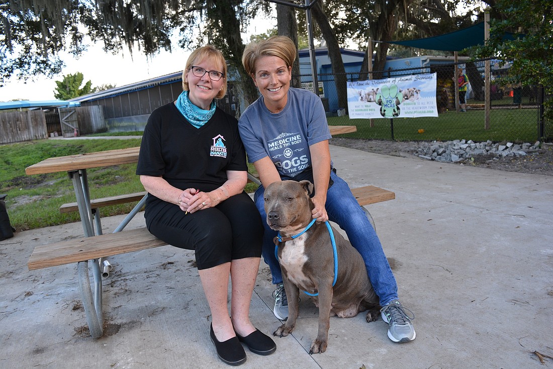 Animal Network Inc. President Pam Freni and Kassandra Zess-Pagel, vice president of Friends of Manatee County Animal Services, are pictured with 13-year-old Oreo. They say the current Animal Services building is in disrepair.