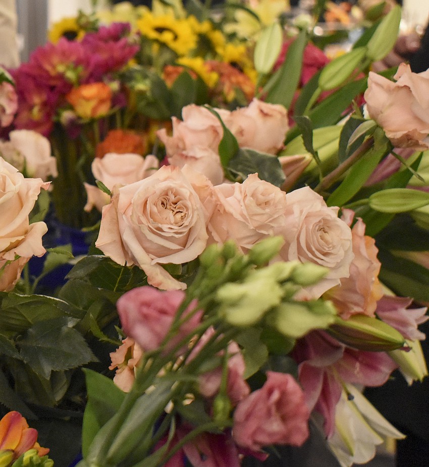 Extra flowers lined the stage so Kathy Rainer and Tricky Wolfes could quickly grab more.