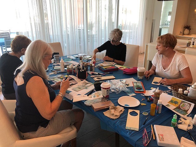 Longboat Key Turtle Watch members join with Sarasota Urban Sketchers to create the hangers. Photo courtesy of Cyndi Seamon.