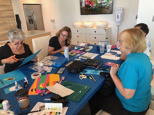 Longboat Key Turtle Watch members join with Sarasota Urban Sketchers to create the hangers. Photo courtesy of Cyndi Seamon.