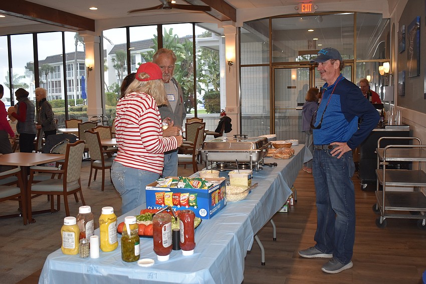 Folks line up for food as it comes out.