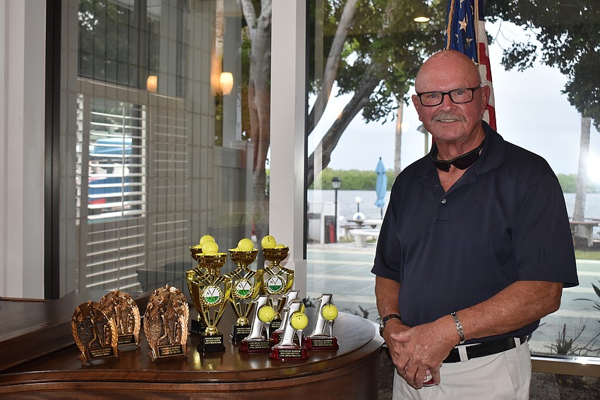 Event organizer John Troup and the awards.