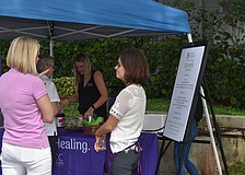 Jessica Hays and Sidney Turner chat at the tent.