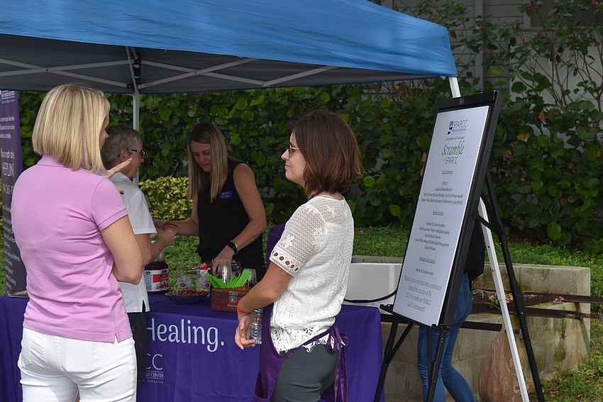 Jessica Hays and Sidney Turner chat at the tent.
