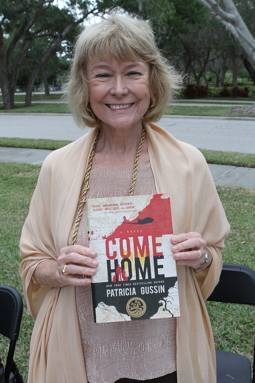 Patricia Gussin with her book