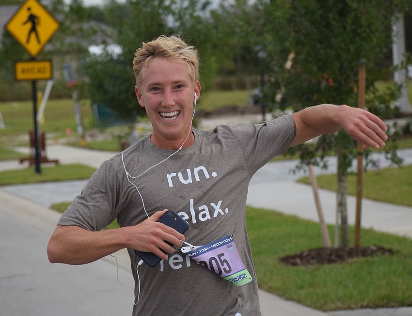 Tom Johnson, the marketing and leasing manager for Lakewood Ranch Commercial Realty, crosses the finished line first in the 5K in 23:31. It was the first time he ever had run a 5K race.