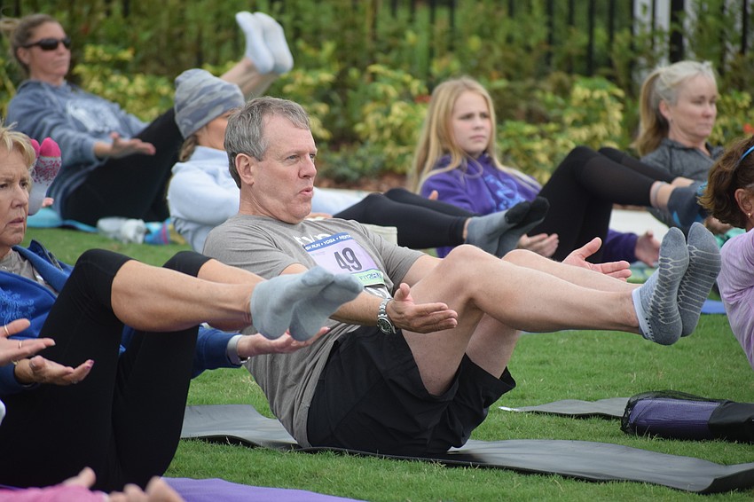 Lakewood Ranch's Mike Evers shows his yoga skills. Evers said he is really big into the brain fitness arena and he wanted to support the event. 