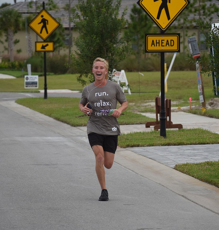 Tom Johnson, the marketing and leasing manager for Lakewood Ranch Commercial Realty, handles the final few yards of the race.
