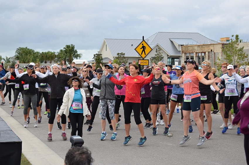 Approximately 250 runners warmed up for the 5K.